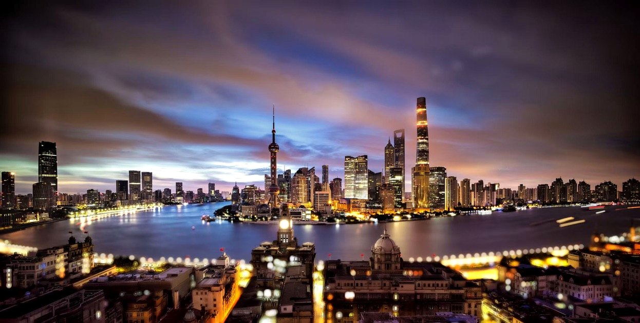 The Bund and Pudong skyline illuminated at night in Shanghai